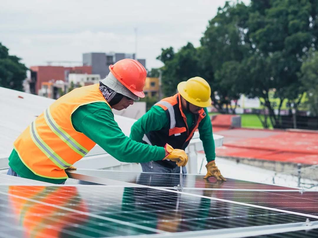 Technicians installing solar panels, one way to help improve EPC rating